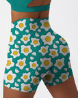 Cartoon fried eggs pattern pastel blue shorts