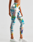 Riding surfboards on top of wave watercolor leggings