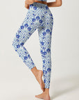 Seamless blue leaves on white leggings