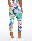 Riding surfboards on top of wave watercolor leggings