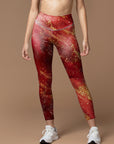 Shimmering gold glitter on red background leggings