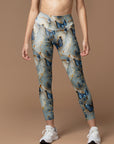 Butterfly floating in gilt water ripples leggings