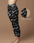 Engraving hand drawn pressed flowers black leggings