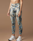 Butterfly floating in gilt water ripples leggings