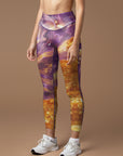 Water ripples with gold sunshine and purple captured leggings