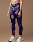 Purple planet with stars in the universe leggings