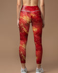 Shimmering gold glitter on red background leggings